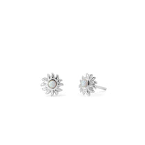 Boma Jewelry Silver sun-shaped earrings with a central gemstone on a white background